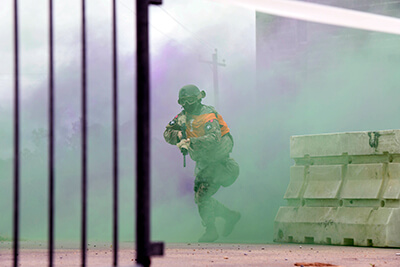 Spc. Jakob Ellingson, a vehicle driver with the Minnesota Army National Guard’s 114th Transportation Company, advances to an assigned point while taking pellet gun fire at an urban training center. Called a “Situational Exercise,” this event measured the competitor’s ability to successfully execute a vast array of Soldier tasks and combat skills with the ultimate goal of securing an objective.